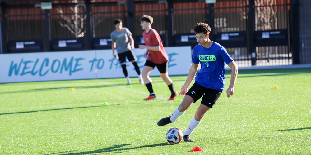 High school students practice soccer at ONE Spokane Stadium.