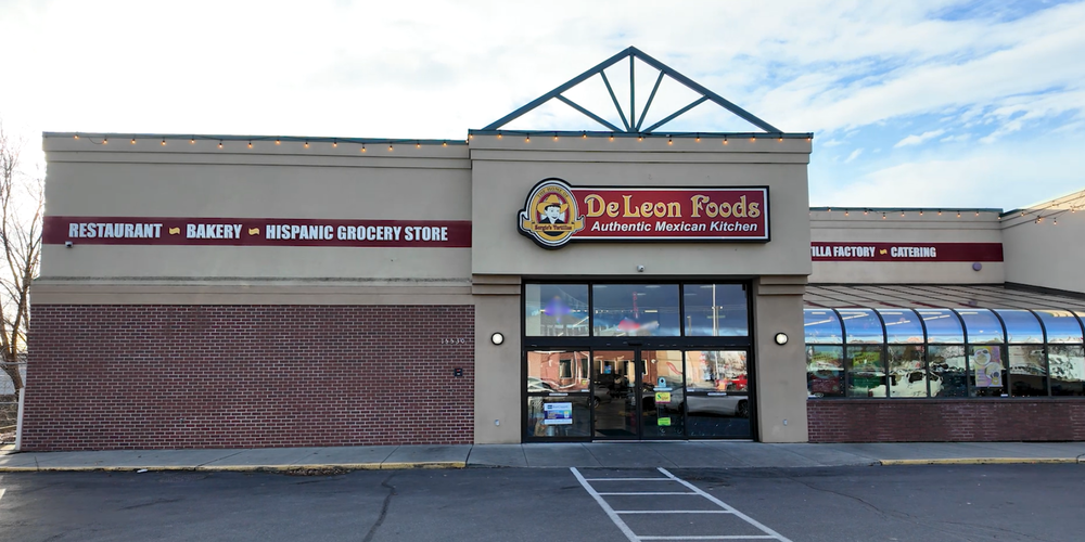 De Leon  Foods Authnetic Mexican Kitchen storefront, promoting a restaurant, bakery, Hispanic grocery store, tortilla factory and catering.