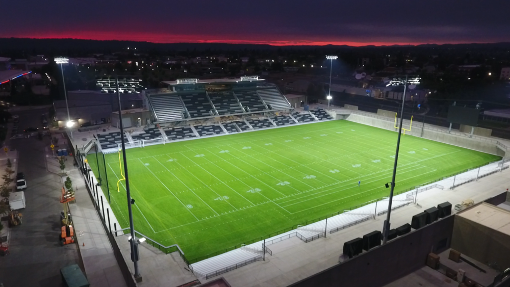 Aerial view of ONE Spokane Stadium at sunset.