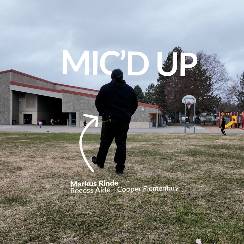 Cooper Elementary School recess aide Markus Rinde walks on a playground field.
