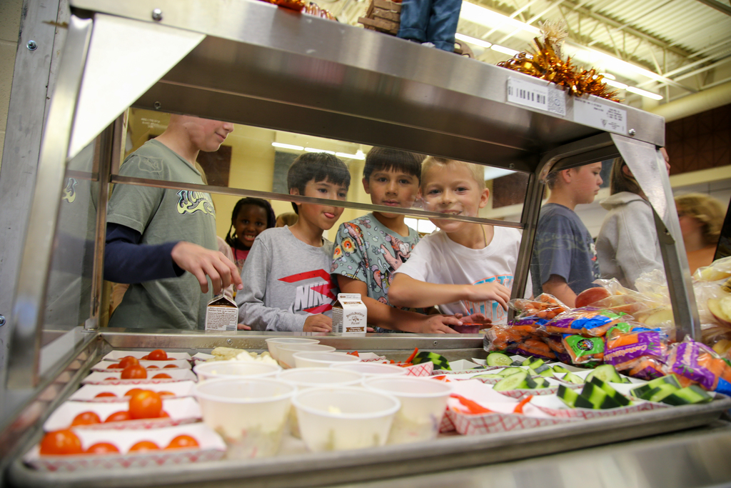 Kids smiling at food cart