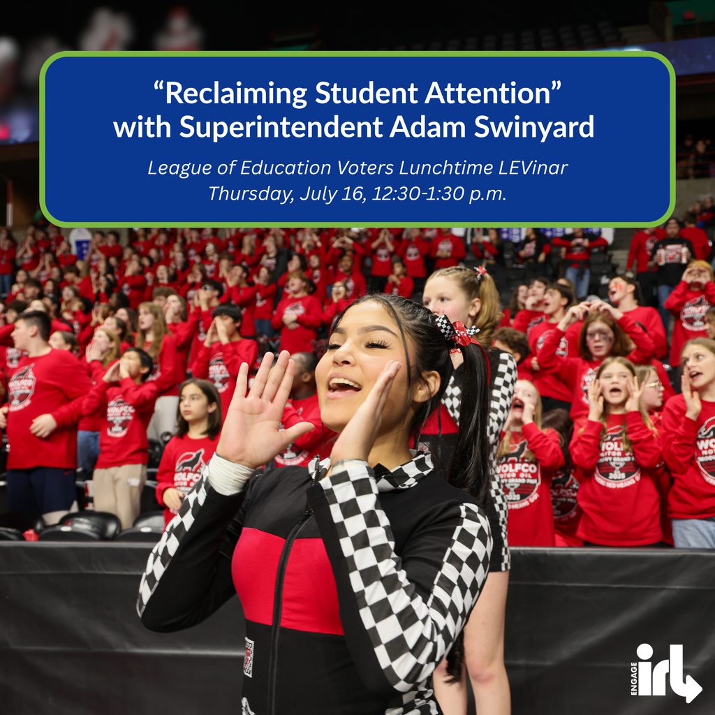 A high school student wearing a black and white checkered racing jumpsuit holds up their hands in a cheer with an area filled with students wearing red in the background. Text is in the post.