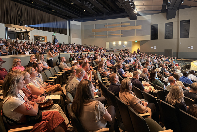 Shadle Park High School auditorium filled with community organization leaders.