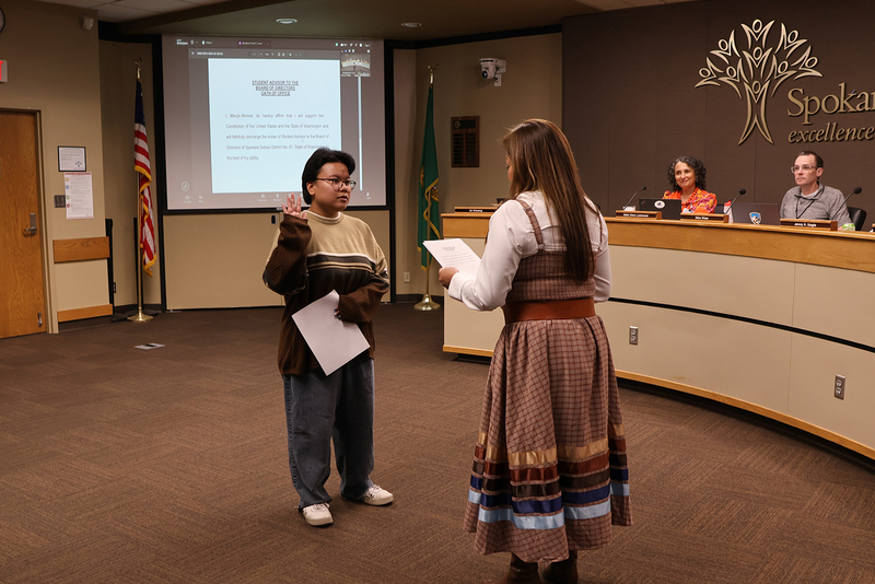 School Board president Jenny Slagle swears in student advisor Jojo Wonne.