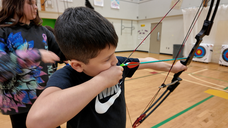 4th Grade Boy in Archery Class