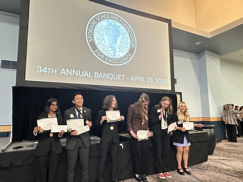 Six Spokane Scholars from Lewis and Clark High School smile with their awards.