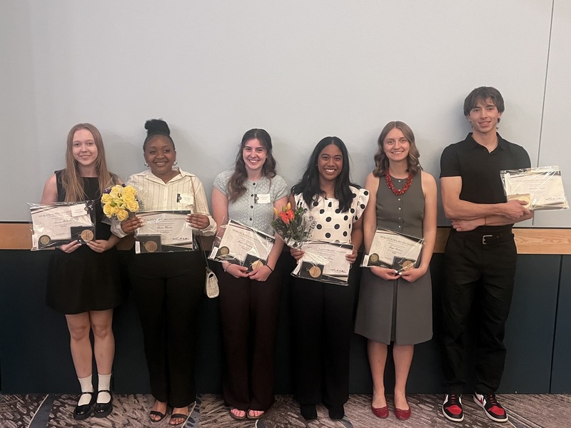 Spokane Scholars from Shadle Park High School smile while holding awards.