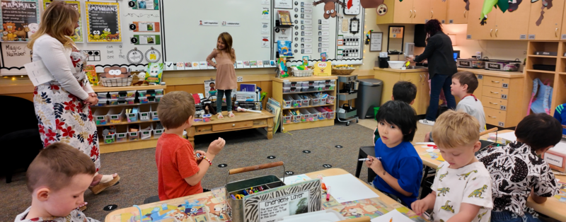 Preschooler being celebrated for accomplishment