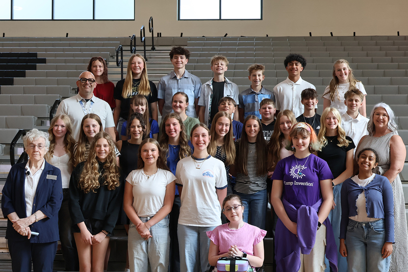 A large group of Peperzak Middle School students and staff pose with Holocaust educator Ingrid Steppic.