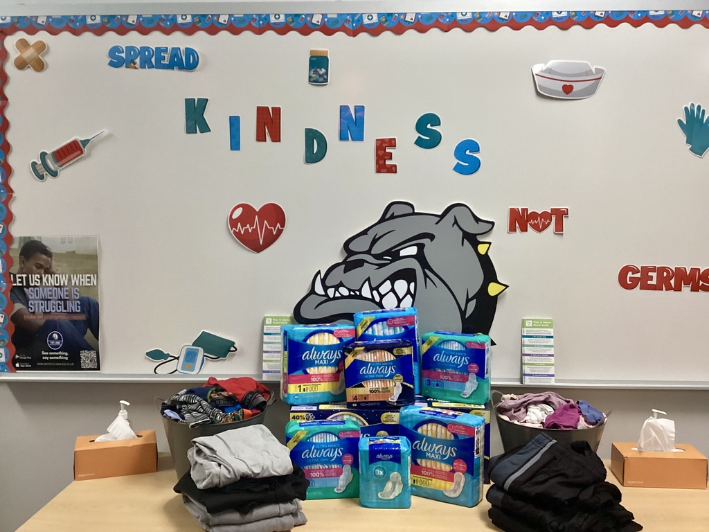 The picture shows feminine products and clothing that have been donated to the school nurse for use with students.