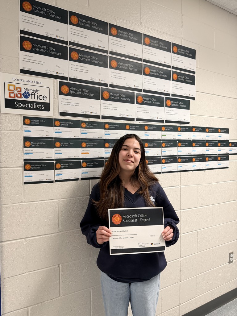 Senior Katie Wallace poses with her Microsoft Office Expert Certification 