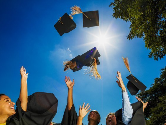 Students Throwing Graduation Caps in the Air