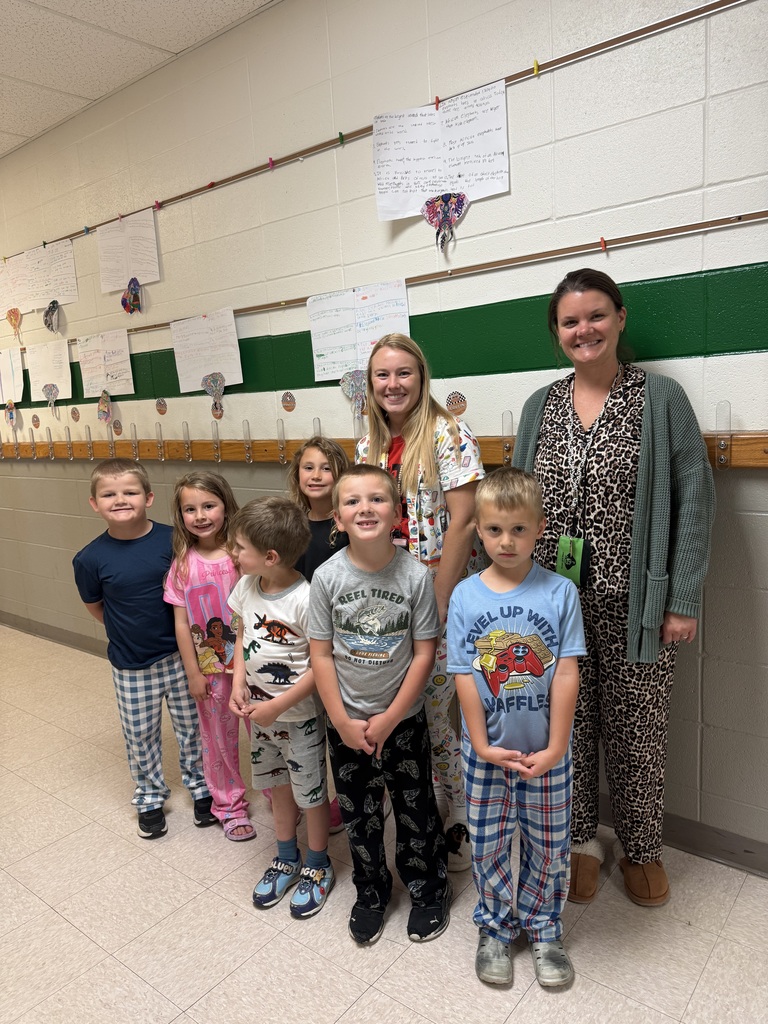 Students and staff in the hallway wearing pajamas for spirit week