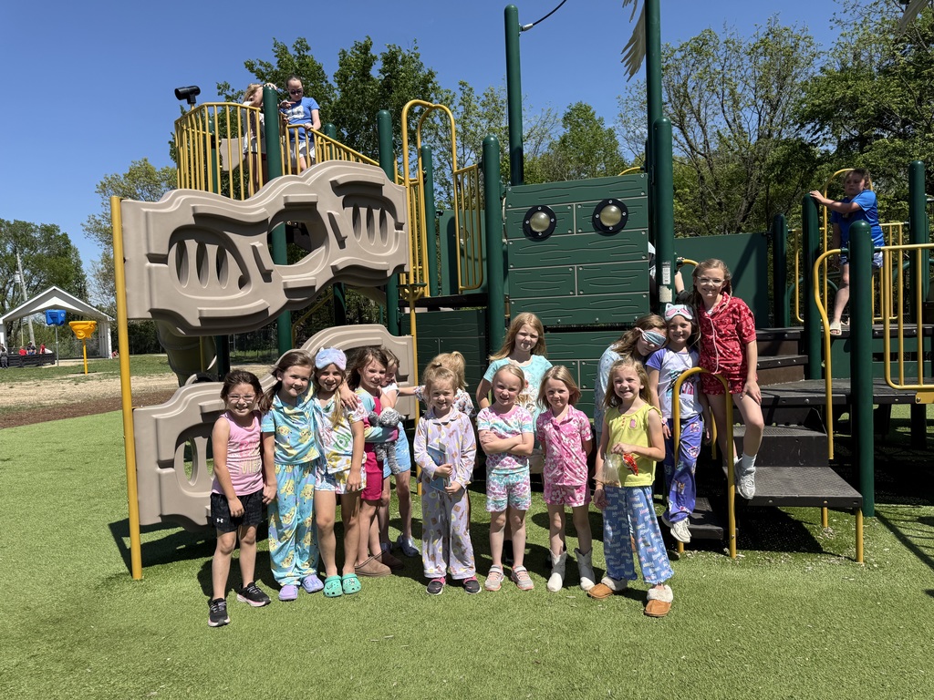 Kids on the playground in pajamas for spirit week