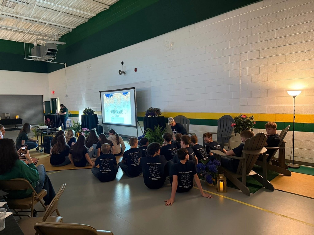 Students watching a video at 8th grade banquet