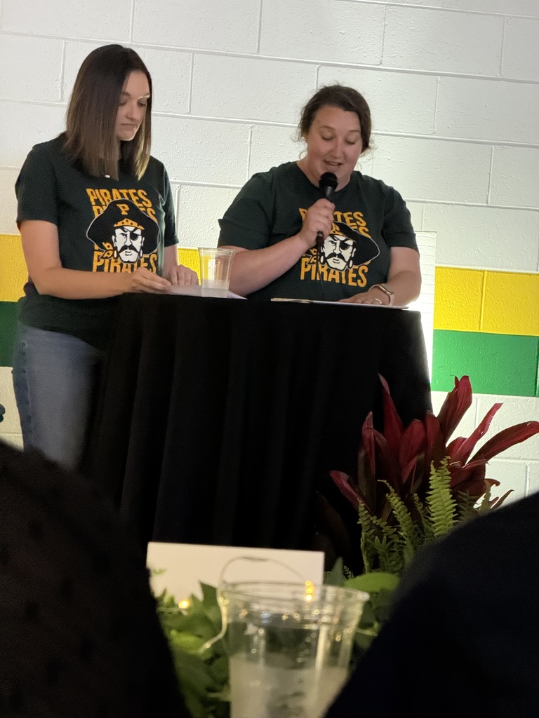 Teachers  reading at the 8th grade Banquet