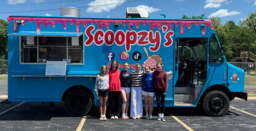 Kids in front of the Scoopzy's  Ice Cream Truck