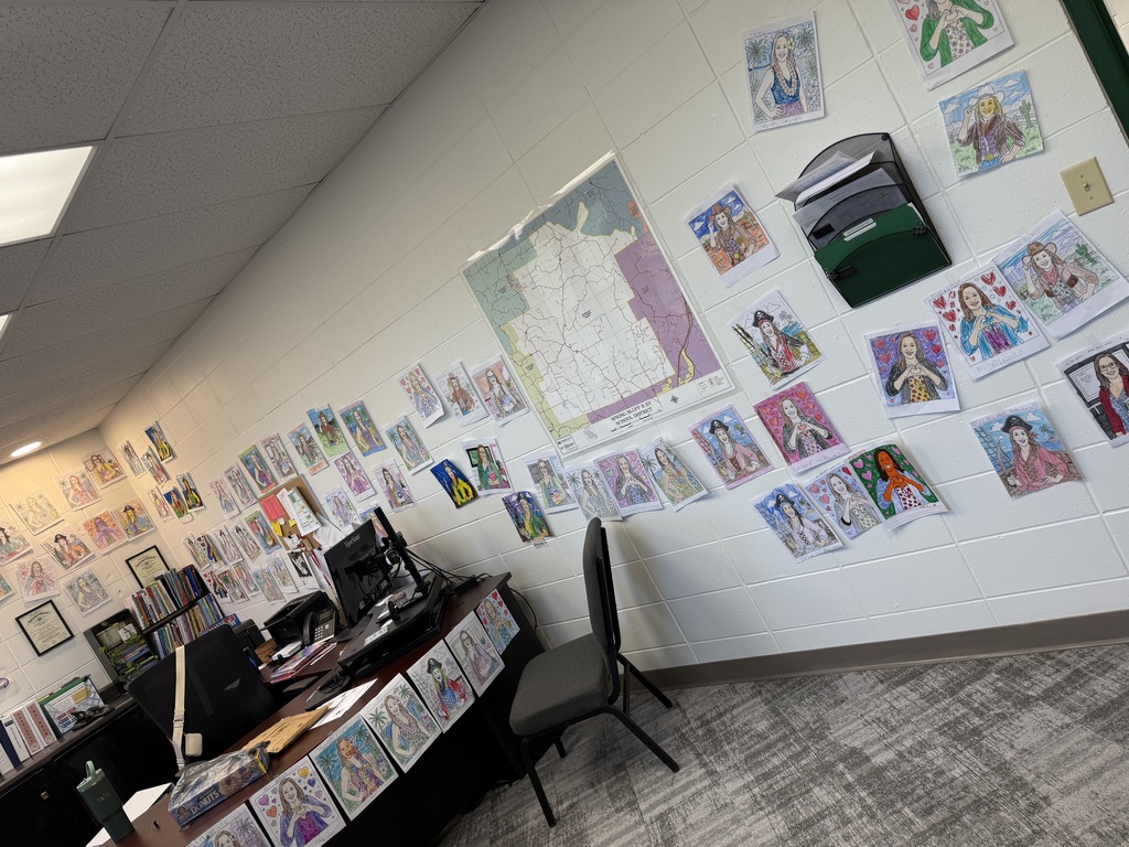 pictures on the wall of the principals office
