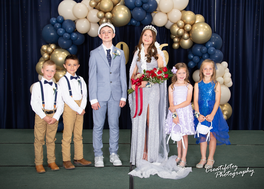 May Queen and King with  flower girls and train- bearers