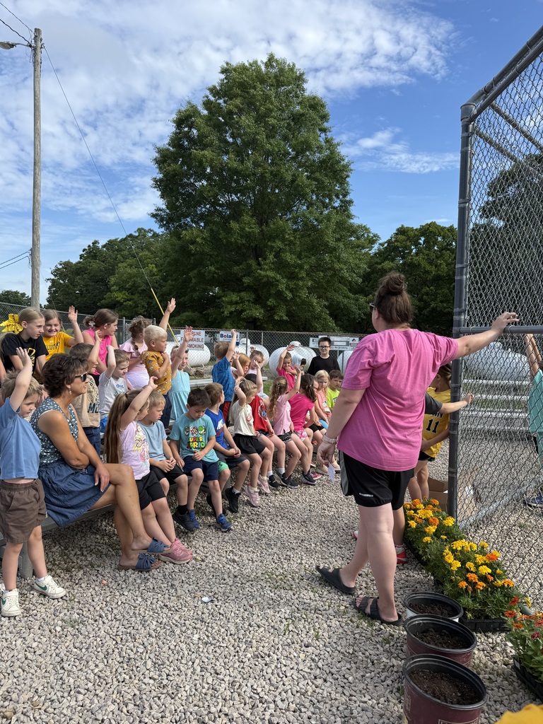 Students with flowers for gardent day