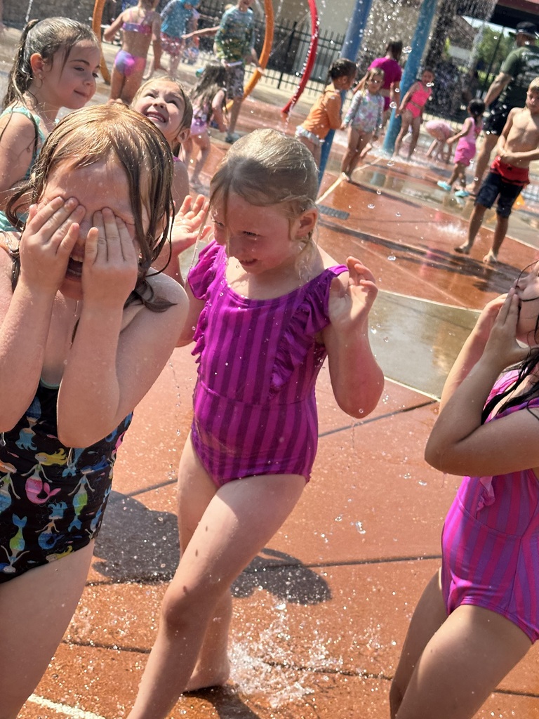 Students playing at the splash pad