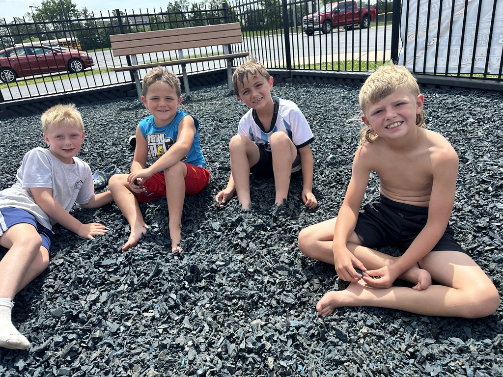 students sitting at the park