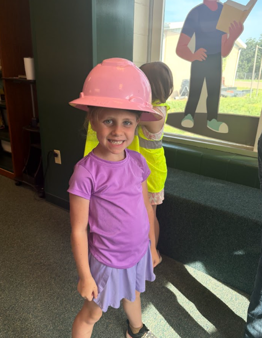 students trying on electric saftey gear