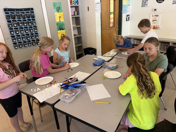 kids doing stem activity 