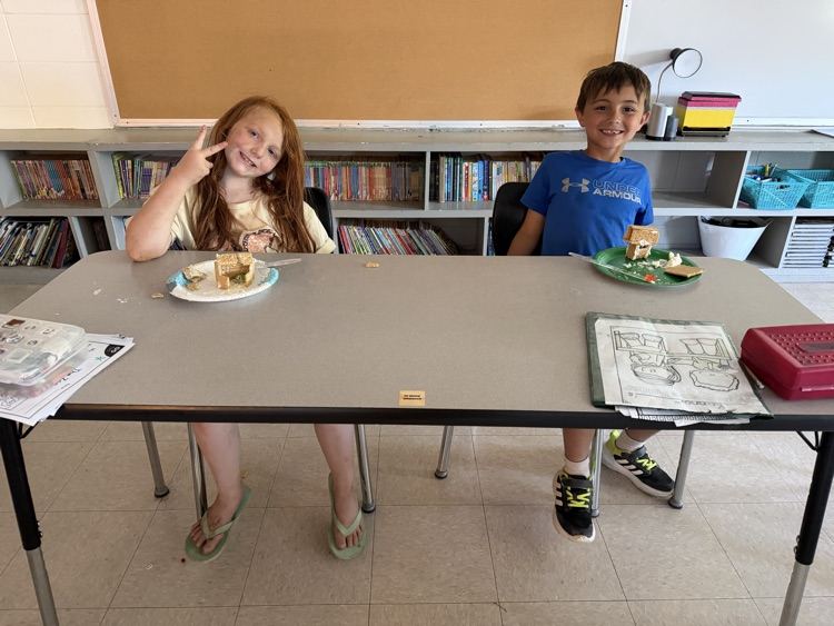 kids with graham cracker and icing “bear den snacks"