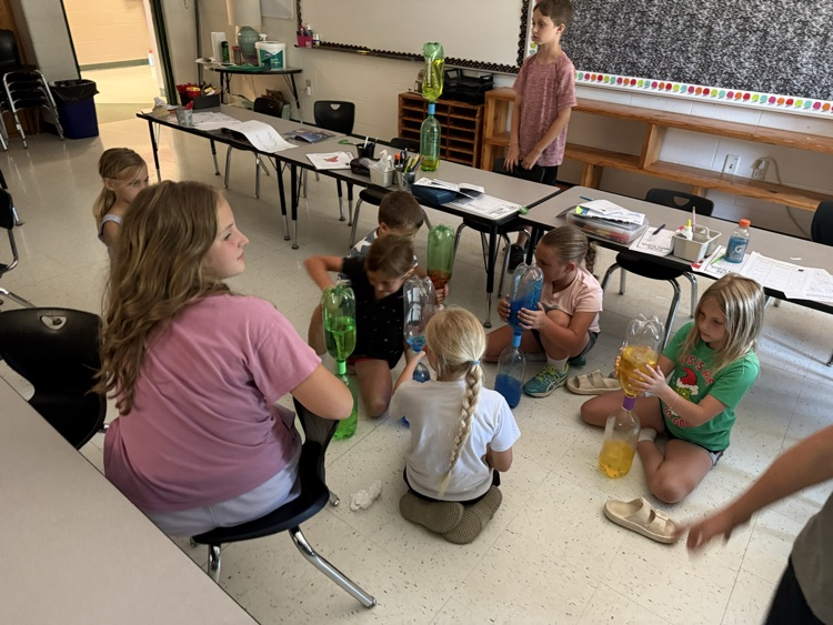 3rd grade SS students making tornadoes 