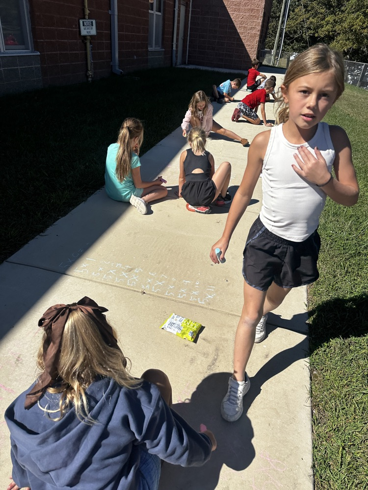 third grade doing multiplication facts outside 