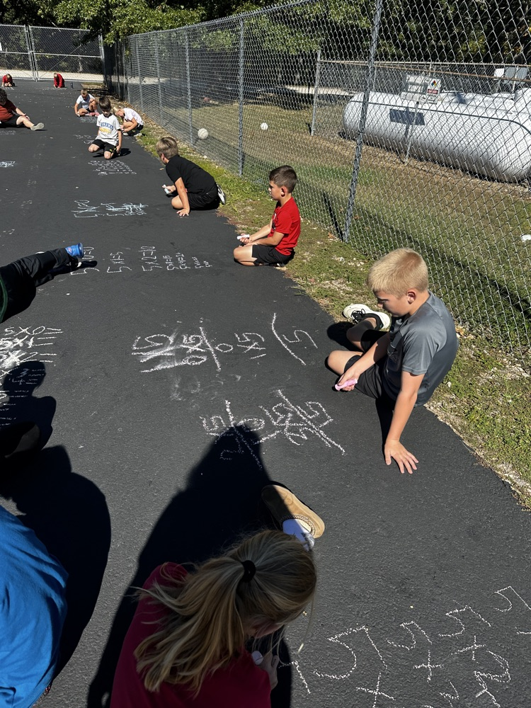 third grade doing multiplication facts outside 