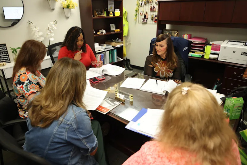 multiple members of the trasportation department gathered around a table