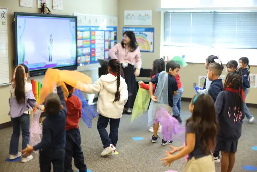 Hsiao-Chuan Teng showing her students a video on a smart board