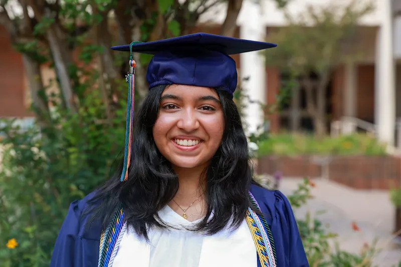 Saloni Singh smiling in graduation attire