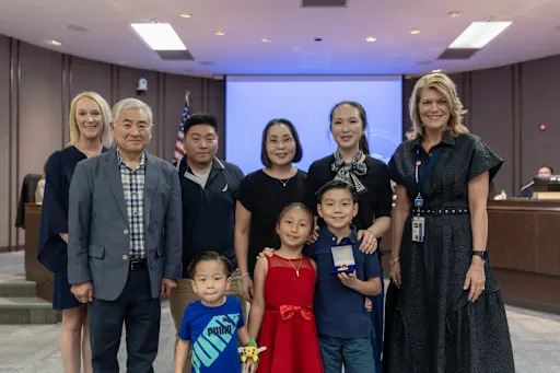 David Jung and family accepting achievement award