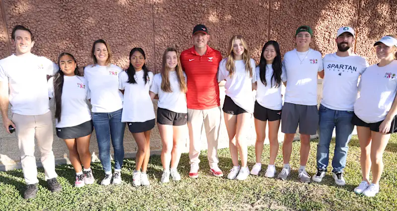 Memorial Tennis Coach Brian Mandell withSBISD players and coaches
