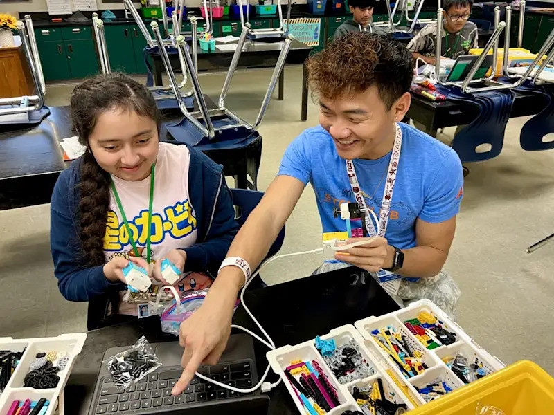 two students using lego