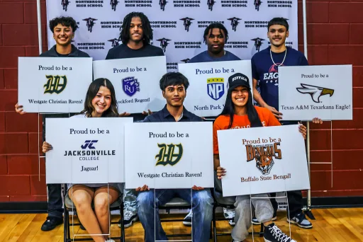 7 graduationg high school students holding signs declaring each of their respective future univerities