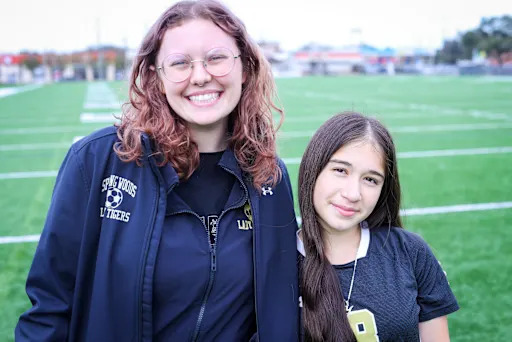 Hope Harlow and Yoselin Gomez on the spring woods field