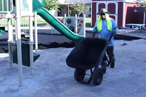 Man holding wheelbarrow