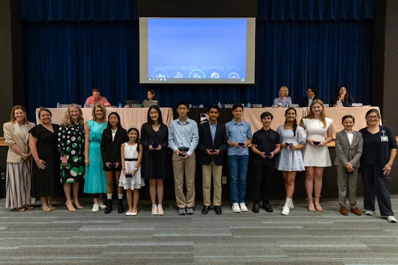 SBAI students acceptign awards for academic achievement