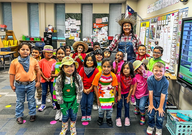 Kayla Theall with students dressed as farmers