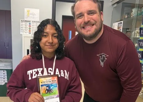 Allisson Contreras receiving an "Artsonia Artist of the Week" award from her teacher Christopher McVay