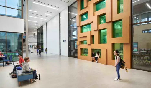 students sitting in a large atrium inside of Bunker Hill Elementary