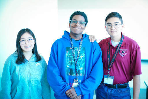 three students posing together