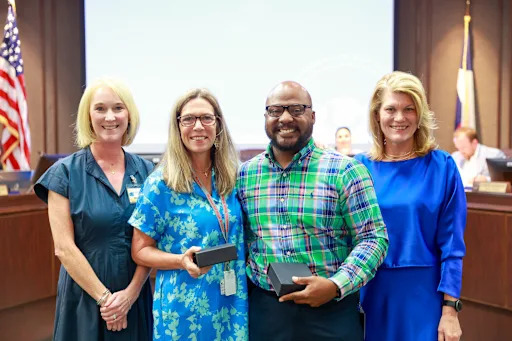 people accepting awards from Dr. Blaine