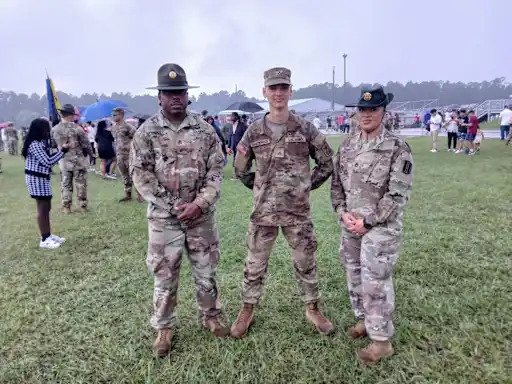 Vilius Bagdzevicius next to other people in full military uniform