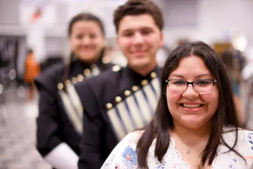 Francis Quintanilla  smiling, two members of the spring woods marching back behind her