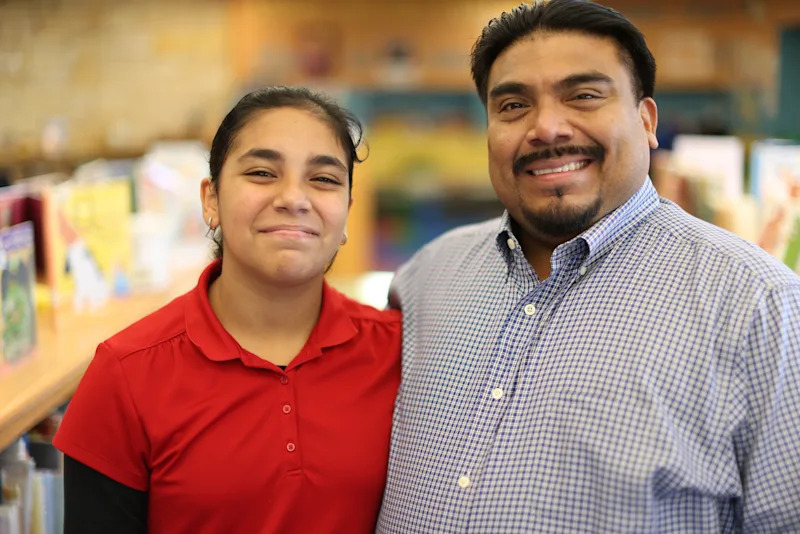 Miguel Brito with a student